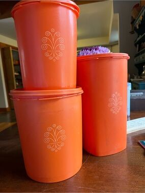 Vintage Orange Storage Canisters with Decorative Motif